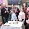 Каждый из юбиляров со своей сладкой фотографией из праздничного торта. Ресторан "Омулевая бочка", 19 октября 2013 г.